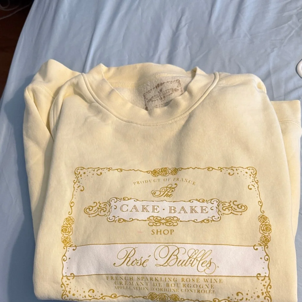 Cake Cream Yellow 'Cake-Bake Shop Rosé Bubbles' Graphic Sweatshirt - Picture 1 of 5